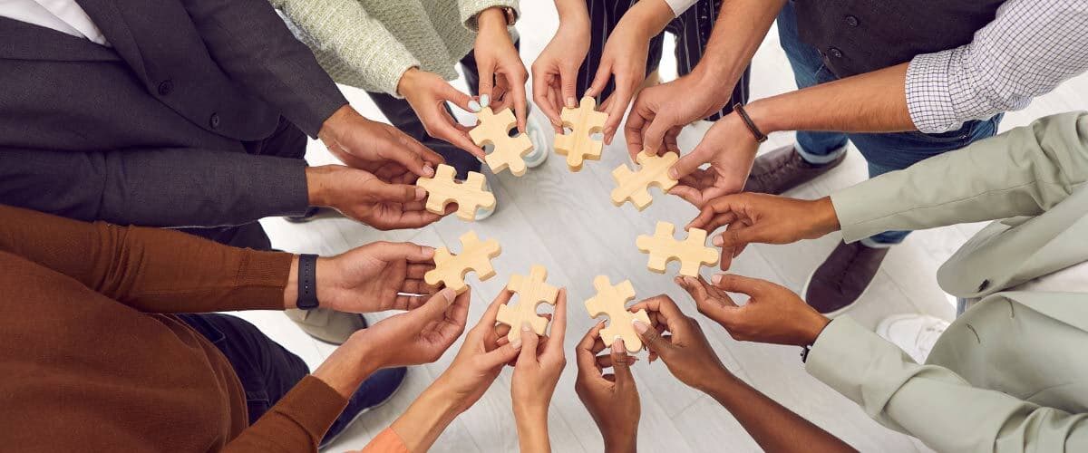 Hands Holding Puzzles Pieces